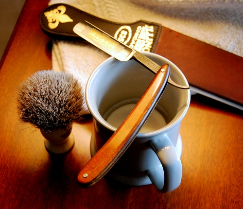 This is my son Matt's straight razor and shaving cup, soap, brush and strop.  He says that using a straight razor produces a cheaper and better shave, although it takes three times longer than with an electric razor.